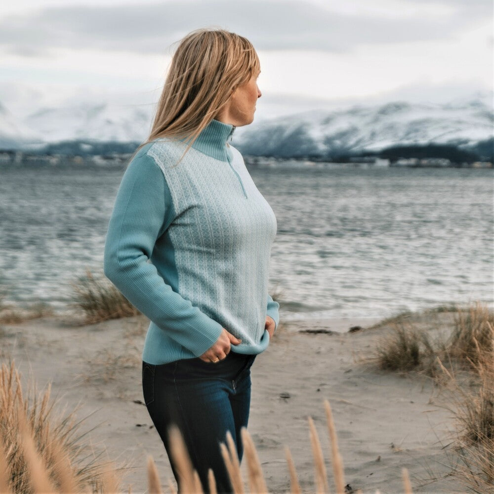 SNØROSE ULLGENSER MED GLIDELÅS, TURKIS/ NATURHVIT